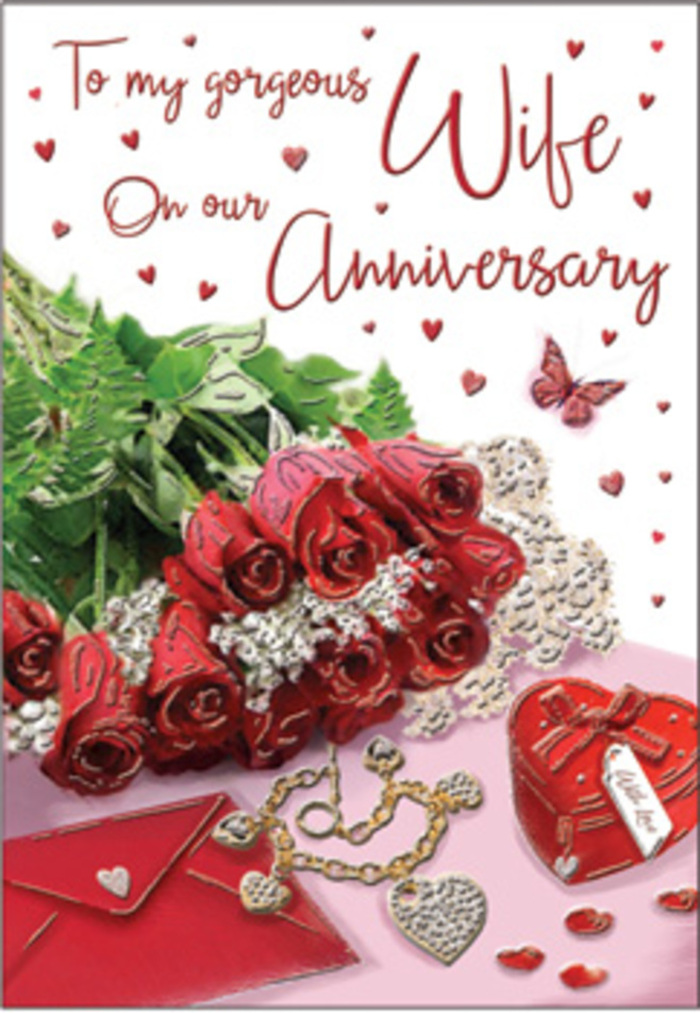 The anniversary card in this image is designed like a miniature celebration, thoughtfully composed with the sensibility of a florist who understands both flowers and emotion. At its heart lies a compact arrangement of classic red roses, each bloom fully open and generously petalled, radiating an intense, velvety crimson that suggests deep affection. These roses are nestled among fresh, glossy greenery, their leaves curving gently around the flowers as if to cradle them, much like a bouquet prepared for same-day delivery around Harlington and the surrounding lanes. An envelope lies close by, its smooth surface and clean fold evoking a heartfelt message carefully written and sealed, ready to be opened by a loved one. Just alongside rest a small heart-shaped keepsake box and a piece of elegant jewellery, their subtle gleam hinting at cherished anniversary traditions: gifts slipped across a table, smiles shared over dinner, and quiet moments of gratitude. Tiny heart decorations are scattered across the composition, echoing the card's sentiment, while a single delicate butterfly motif adds a note of grace and transformation, suggesting love that has grown through the years. The lighting falls softly over the scene, as if it were lit by the natural daylight filtering through windows of a Harlington home, creating gentle shadows and highlights that add depth. The palette is dominated by warm reds, soft creams, and metallic accents, giving the image a cosy yet sophisticated feel. Every element-from the imagined scent of the roses to the tactile contrast of card, petals, and smooth metal-works together to evoke an anniversary celebrated quietly and meaningfully in the familiar streets and homes of Harlington.